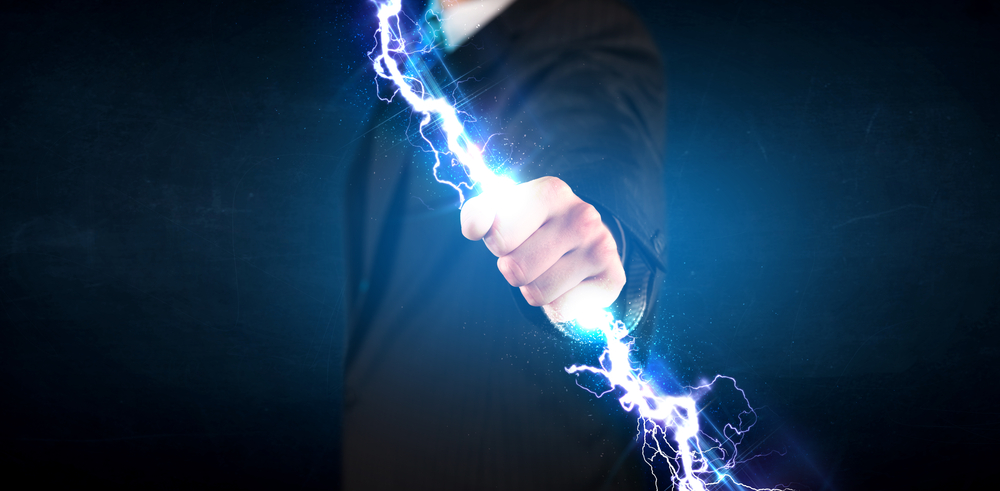 Business man holding electricity light bolt in his hands concept.jpeg