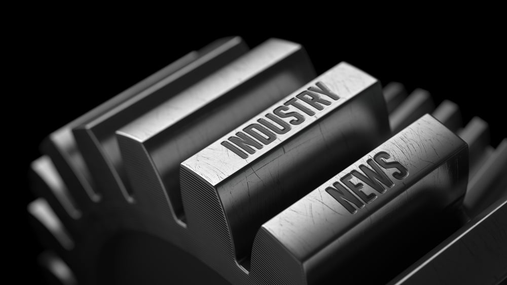 Industry News on the Metal Gears on Black Background.