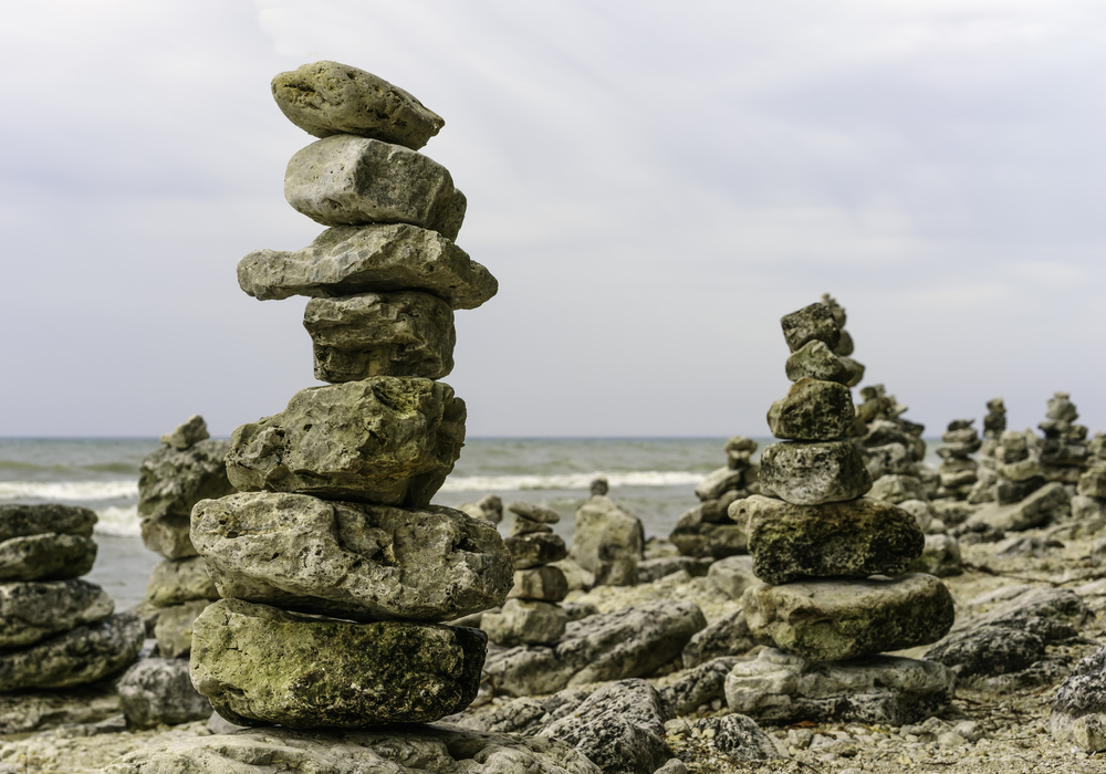 Invasion of rock creatures Beach taken over by rock balancers from another world perhaps to warn us of an impending shift in universal gravity and rearrangement of the natural world!