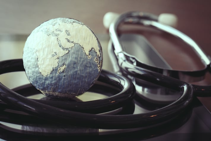 stethoscope and texture globe with digital tablet as medical network concept