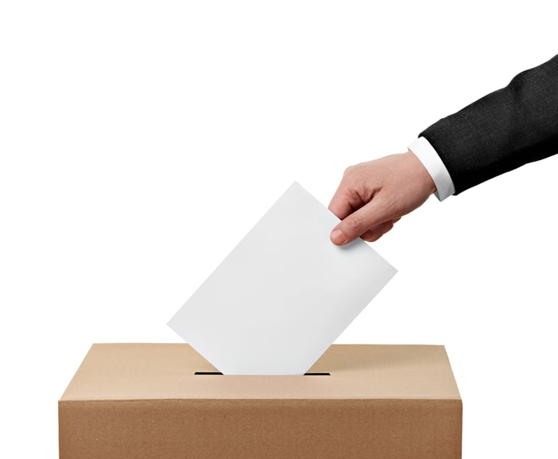 close up of  a ballot box and casting vote on white background-1