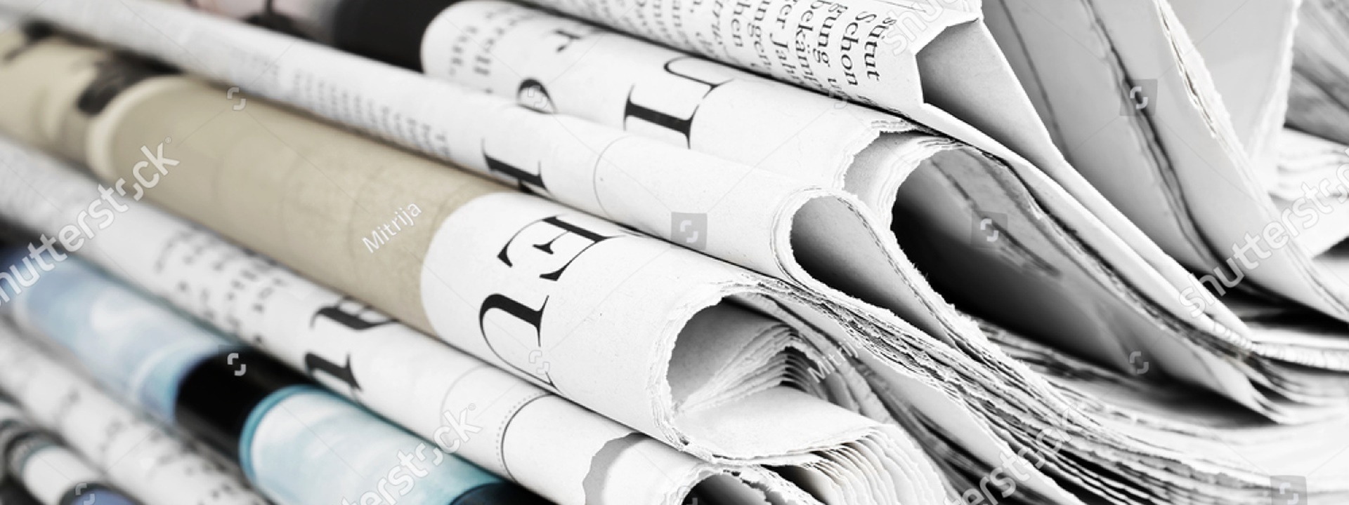 stock-photo-pile-of-old-newspapers-selective-focus-198536522_1920 720
